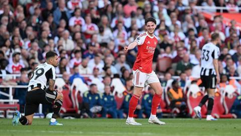 Declan Rice of Arsenal interacts with Bruno Guimaraes of Newcastle 
