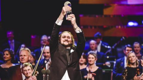 BBC Cardiff Singer of the World winner 2019 Andrei Kymach lifts trophy