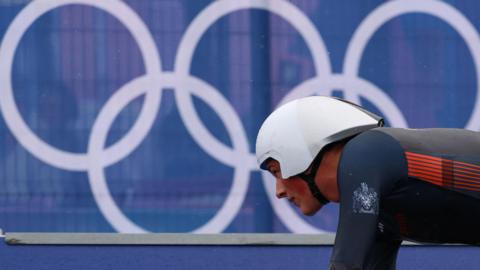 Josh Tarling competes in the time trial