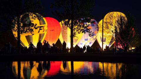 Hot air balloons lit up