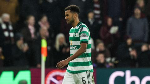 Auston Trusty walks off after being sent off at Tynecastle