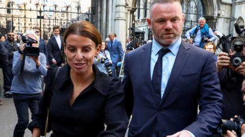 Coleen Rooney, pictured with Wayne Rooney outside court, is being sued for libel