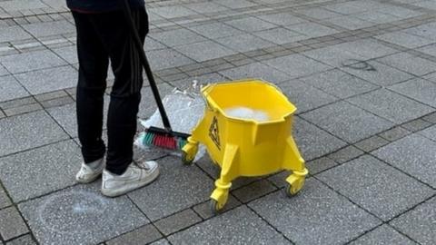 A bucket being used to tidy up