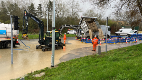 Burst water main in Mead Way