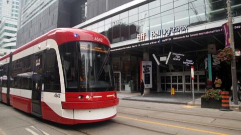 Photo of Toronto streetcar in front of TIFF Building