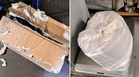 A carboard box which is slighly open with white poswer around it, and a large white bin bag on some steel weighing scales. 
