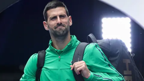 Novak Djokovic walks on to court