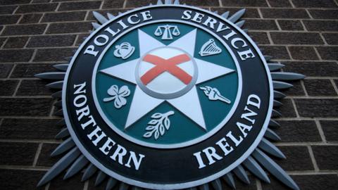 A coat of arms is pictured at the Police Service of Northern Ireland Headquarters. 