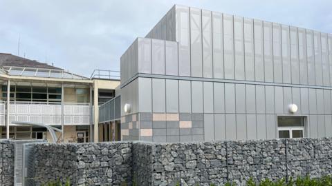 Critical Care Unit - a silver metal building