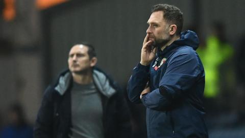 Blackburn Rovers boss in the dugout during their game against Coventry City