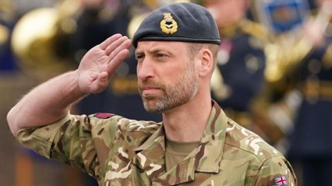 The Prince of Wales, Royal Honorary Air Commodore for RAF Valley, during a visit to the airbase in Holyhead, Anglesey, as part of celebrations marking its 85th anniversary.