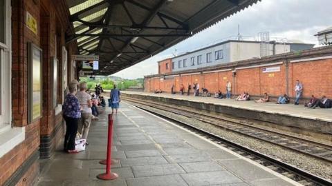 A picture from a railway track taken from a train station platform. 