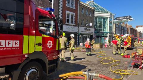 Firefighters are tackling a blaze in Sutton High Street