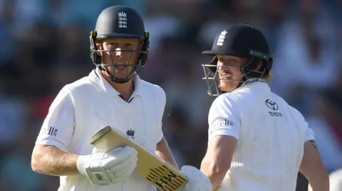 England batters James Rew (left) and Jordan Cox (right) run between the wickets