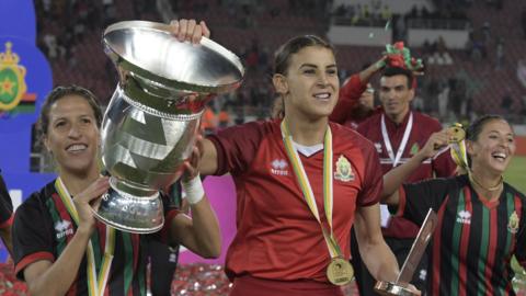 AS FAR players celebrate with the Women's African Champions League trophy
