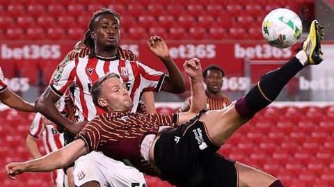 Bradford's Nick Powell attempts a bicycle kick against Stoke