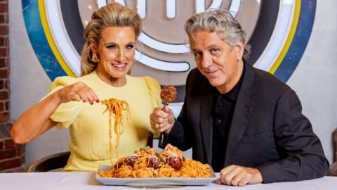 Grace Dent and Giorgio Locatelli pictured with a plate of spaghetti meatballs and the MasterChef logo in bbthe background