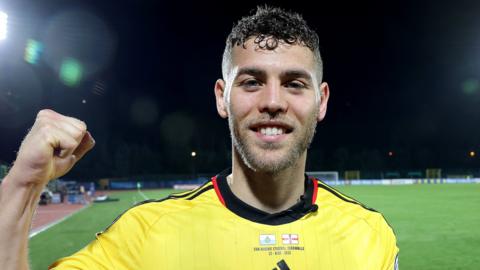 Dion Charles celebrates after Northern Ireland's win in San Marino