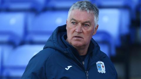 Rob Kelly wearing a Barrow jacket during his spell in caretaker charge