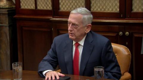 James Mattis at a table