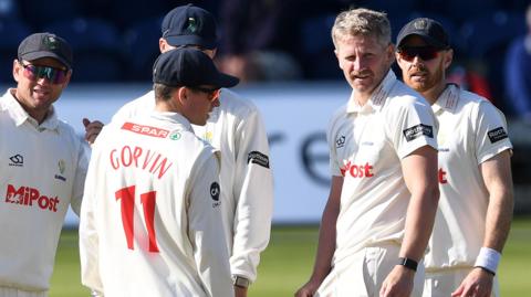 Glamorgan players celebrate taking a wicket