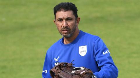 Azhar Mahmood standing on the field