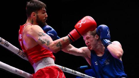 Callum Makin lands a jab on the chin of Rami Kiwan