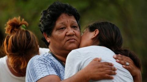 Relatives of miners trapped in a coal mine that collapsed, react as they wait outside the mine, in Sabinas, Coahuila state, Mexico August 14, 2022.