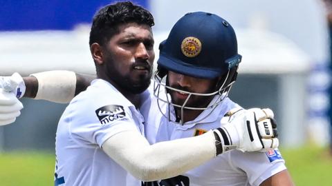 Sri Lanka's Nishan Madushka celebrates with his teammate Kusal Mendis (R) after scoring a double century