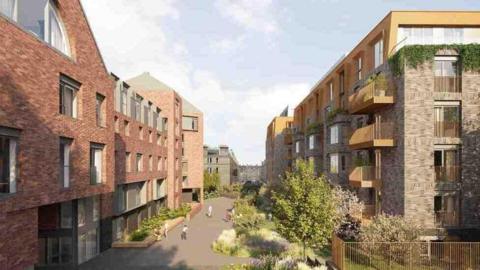 An artist impression of blocks of new builds on either side of a path. Some of the buildings are red brick and others brown brick.