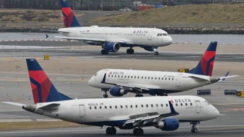 planes queue on a runway