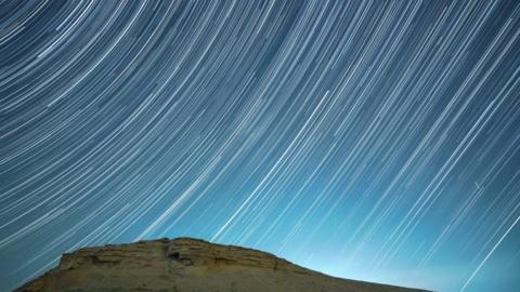 A meteor streaks across the night sky in Bazhou, Xinjiang Province, China, in the early morning of December 14, 2021.