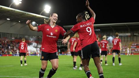 Elisabeth Terland celebrating with Melvine Malard