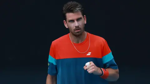 Cameron Norrie celebrates