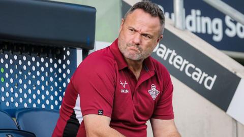 Huddersfield Giants coach Jim Lenihan looks on from the sidelines against Leeds Rhinos in May.