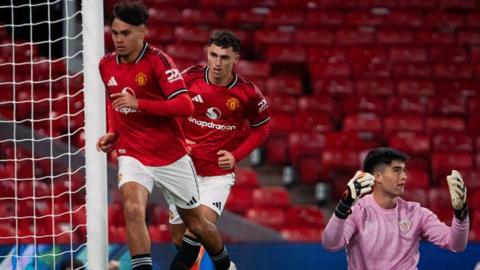 Manchester United forward Gabriel Biancheri and goalscorer James Scanlon at Old Trafford