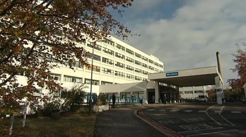 A picture of the maternity department at the John Radcliffe Hospital in Oxford. It is a white six-storey building