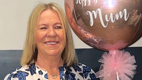 Ann Dunn with birthday balloon