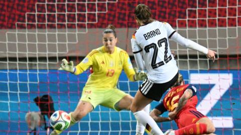 Spain goalkeeper Cata Coll denies Jules Brand in the Nations League final first leg