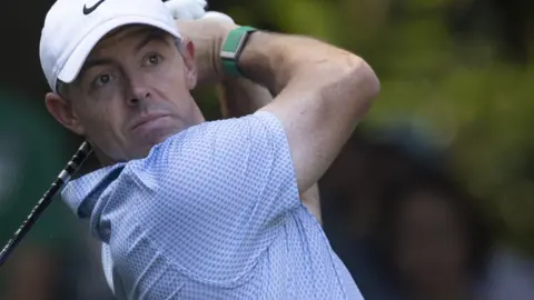 Rory McIlroy stares after hitting a tee-shot during the final round of the Masters at Augusta National