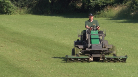 Jimmy Broadhouse at work on his mower