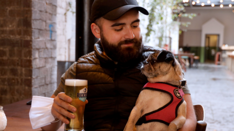 Thomas McAuley and dog Jo in White’s Tavern