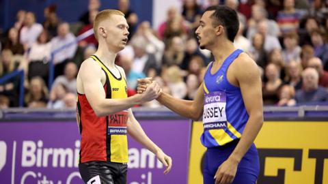 Ethan Hussey congratulates Ben Pattison of Great Britain celebrates after winning on the 800m men final 