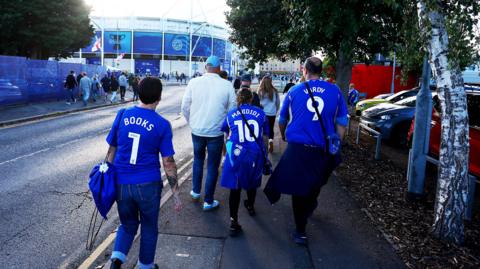 Leicester fans walking towards the King Power Stadium