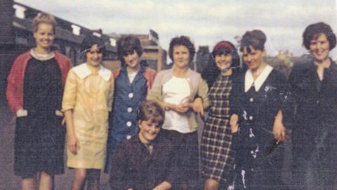 a group of workers at the Burton factory