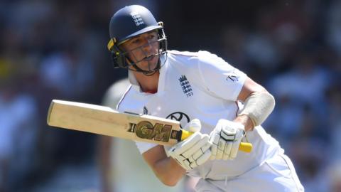 England's Matthew Fisher plays a shot