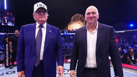 US president Donald Trump stands next to UFC president Dana White 