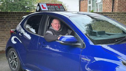 Driving instructor Martin Pitchley in his car