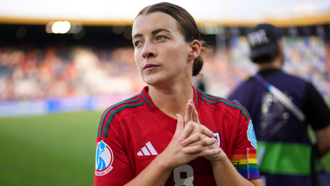 Angharad James-Turner of Wales looks on, while wearing the Rainbow UEFA Respect captains armband after the teams defeat in the UEFA Women's EURO 2025 Group D match between Wales and Netherlands at Luzern Arena on July 05, 2025 in Lucerne, Switzerland. She is wearing a red Wales kit