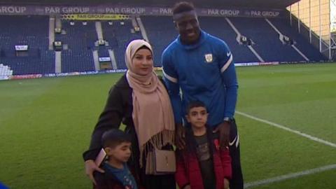 Bambo Diaby and a family